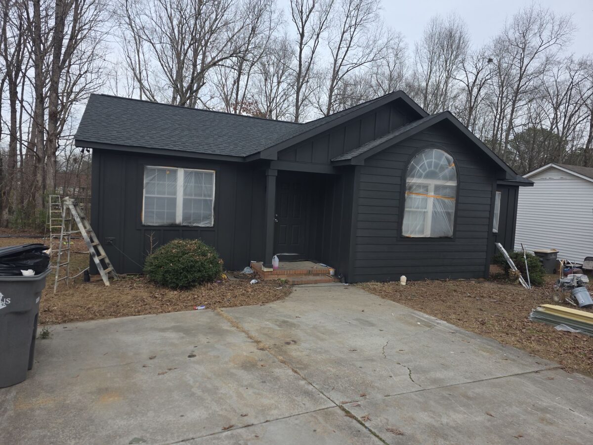 Dark board and batten siding installation